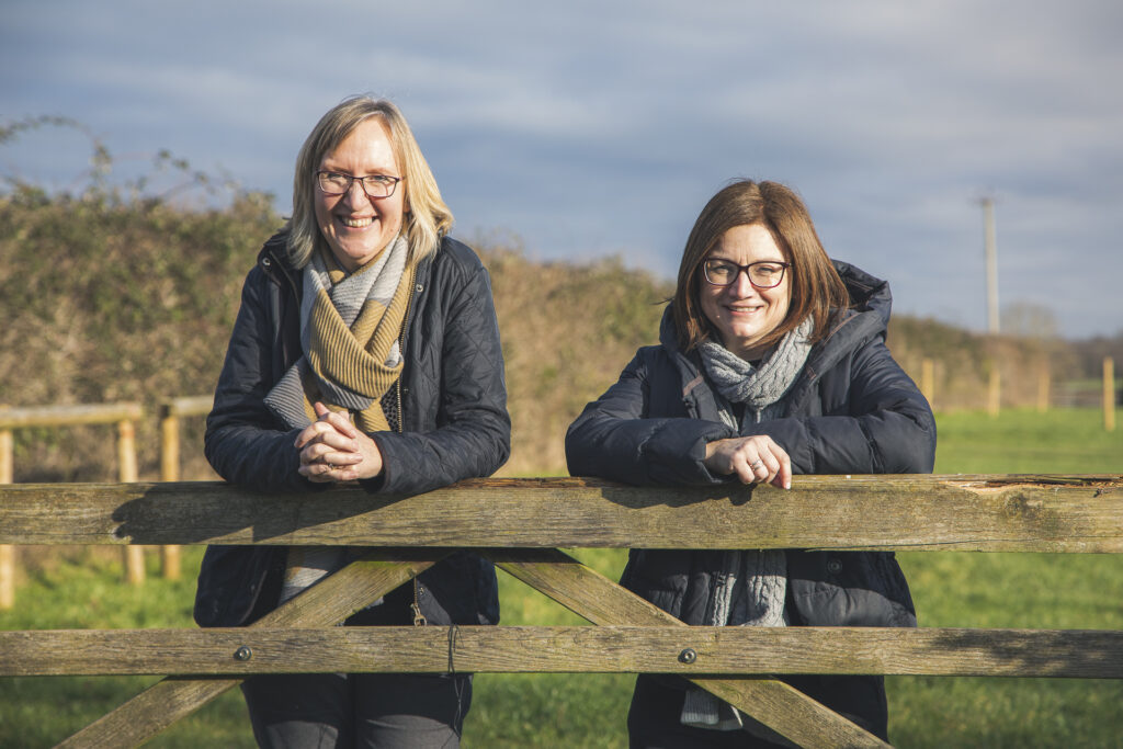 Marchwood Marketing Tanya and Laura leaning on gate in field for content development